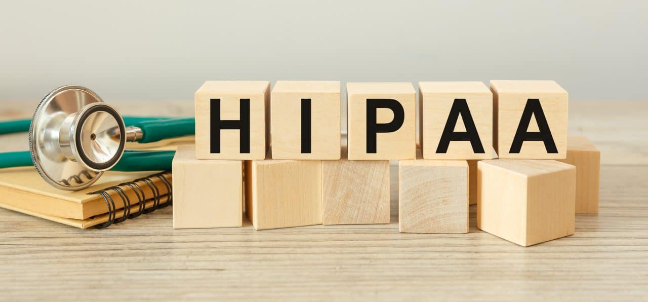Wooden block form the word HIPAA The Health Insurance Portability and Accountability Act of 1996.