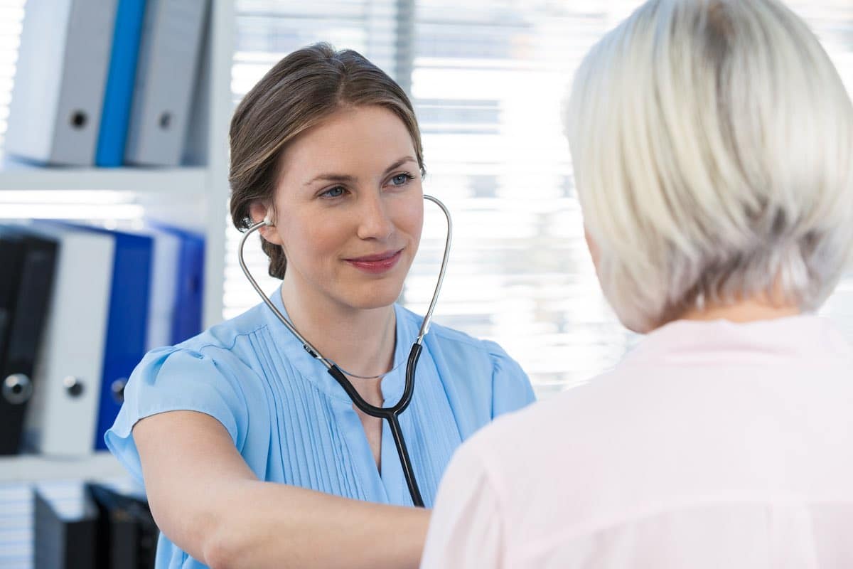 Doctor examining a patient with stethoscope