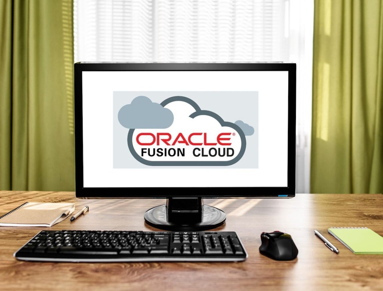 Oracle Fusion Cloud logo on computer screen