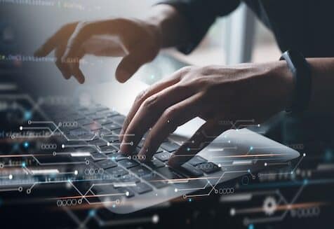 Digital technology, software development concept. Coding programmer working on laptop with circuit board and javascript on virtual screen