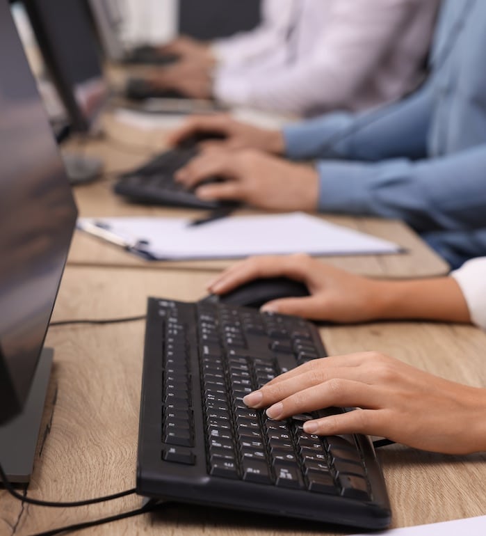 Call center operators working in office, closeup